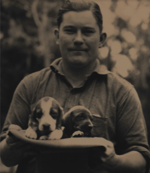 Tom Yawkey with puppies